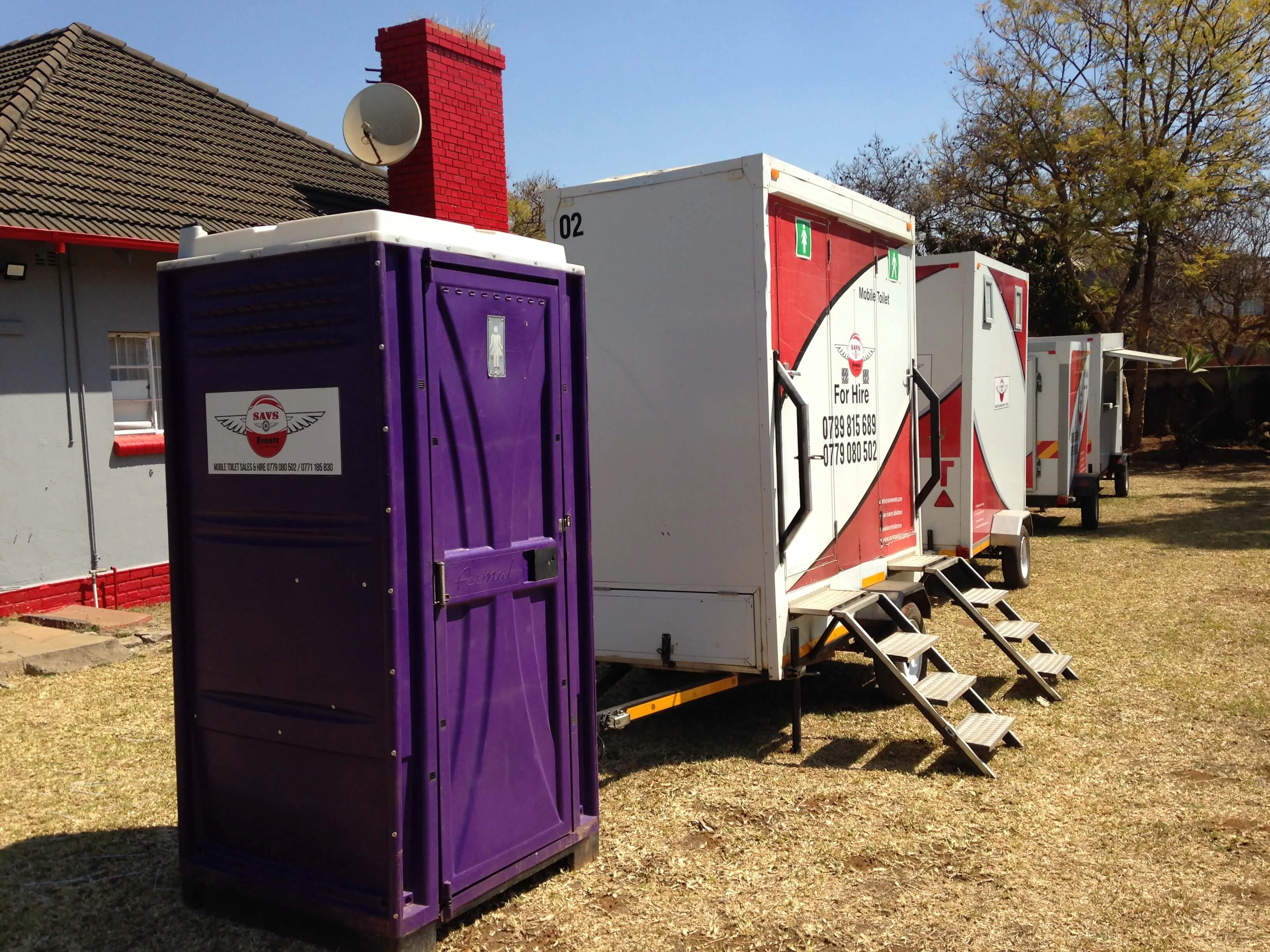 SAVS mobile toilet trailers and portable units staged outdoors